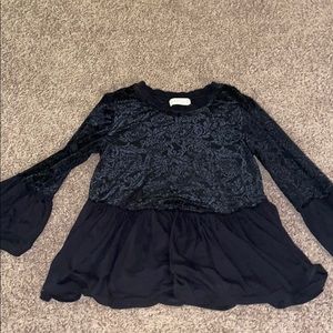 black lace patterned top with flowy arms